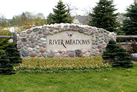 engraved architectual signage with river rocks