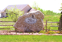 engraved boulder with logo